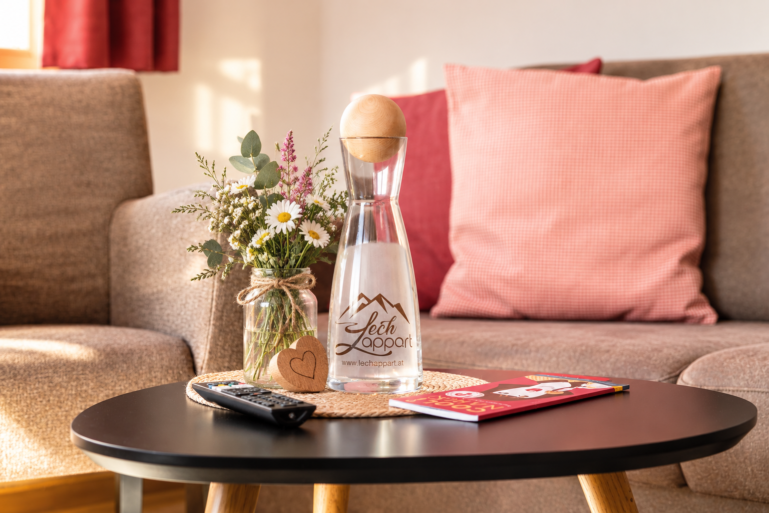 Lechappart apartment living room with flowers and welcome carafe